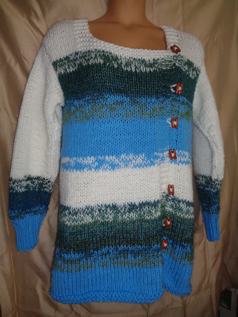 Sweater jacket in white bright summer sky blue and bluegreen variegated yarn Warm and comfy for outside. Size 1X 22-24