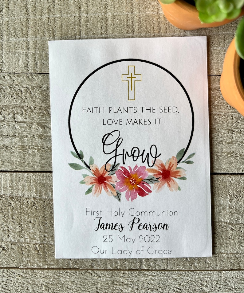 May include: White card with a black circle and gold cross. The text inside the circle reads "Faith plants the seed, love makes it grow". Below the circle are the words "First Holy Communion James Pearson 25 May 2022 Our Lady of Grace".