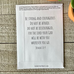 May include: White card with a black and white inspirational quote from Joshua 1:8-9. The quote reads "Be strong and courageous. Do not be afraid; do not be discouraged, for the Lord your God will be with you wherever you go." The card also includes growing directions for planting seeds.