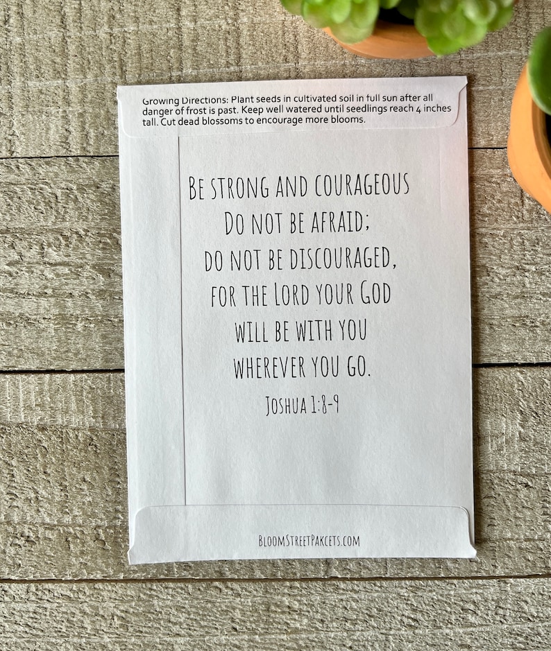 May include: White card with a black and white inspirational quote from Joshua 1:8-9. The quote reads "Be strong and courageous. Do not be afraid; do not be discouraged, for the Lord your God will be with you wherever you go." The card also includes growing directions for planting seeds.