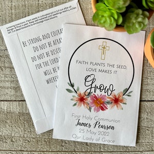 May include: White seed packet with a floral design and the text "Faith plants the seed. Love makes it grow."  The packet also includes the text "First Holy Communion James Pearson 25 May 2022 Our Lady of Grace".