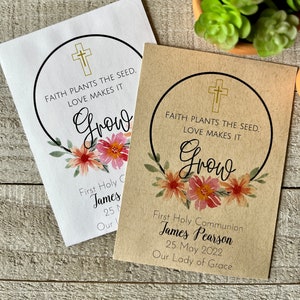 May include: Two brown paper seed packets with a floral design and the text "Faith plants the seed. Love makes it grow."  The first packet has the text "First Holy Communion James 25 Our" and the second packet has the text "First Holy Communion James Pearson 25 May 2022 Our Lady of Grace".
