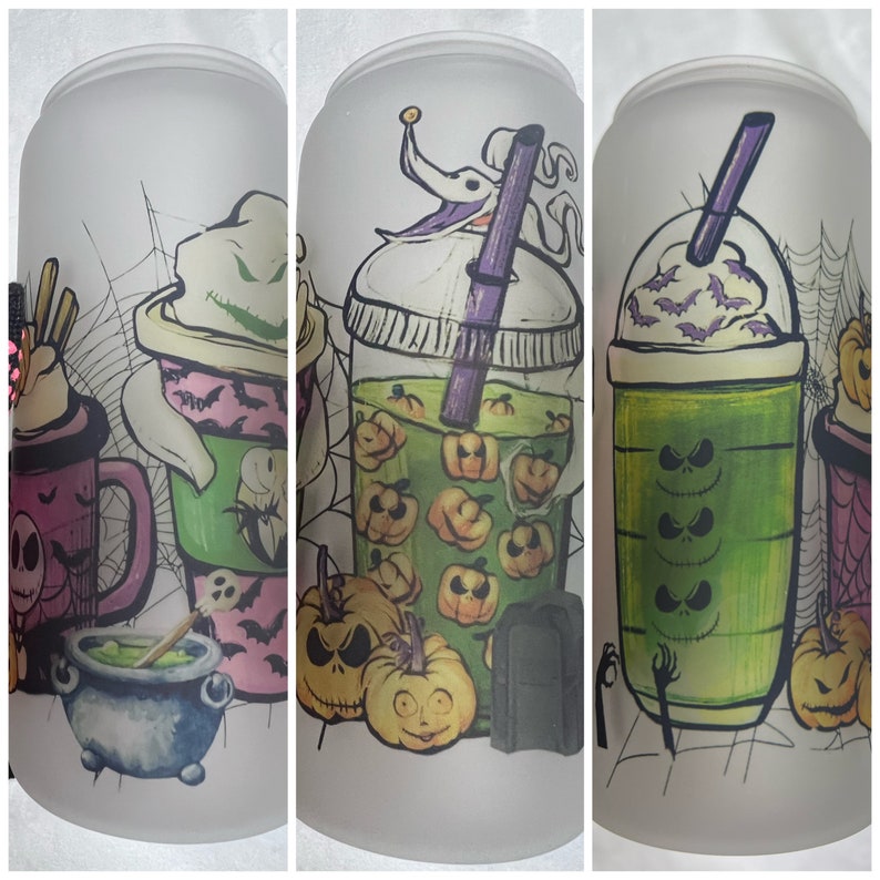 May include: Three frosted glass tumblers with Halloween-themed designs. The first tumbler features a pink and green drink with a ghost and bats. The second tumbler features a green drink with a Jack Skellington design and pumpkins. The third tumbler features a green drink with a Jack Skellington design and bats.