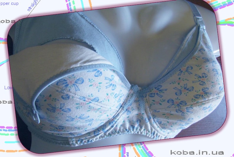 May include: A light blue bra with a white and blue floral pattern. The bra has a light blue strap and a white lining.