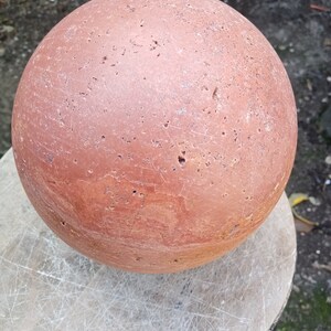 Sphere in red travertine