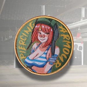 May include: Round embroidered patch featuring a cartoon woman with red hair and a green military helmet. The woman is wearing a blue and white striped top. The patch has the words "PIERCING ARMOUR" in green lettering around the edge.