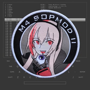 May include: A round embroidered patch featuring an anime-style character with red eyes and pink hair, holding an eyeball. The patch has the text "M4 SOPMOD II" in a circular design. The background shows a computer terminal.