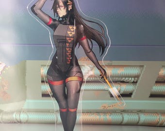 May include: A clear acrylic figure of a female anime character in a black and orange bodysuit. The character has long black hair and is holding a yellow weapon. The figure is standing in front of a pixelated background.