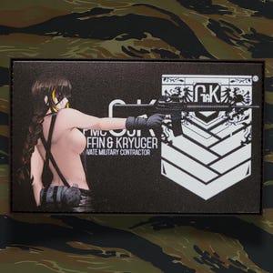 May include: A rectangular patch with a black background featuring a stylized anime-style character holding a rifle. The patch includes the text "GRIFFIN & KRYUGER PRIVATE MILITARY CONTRACTOR" and a white emblem with the letters "G&K".