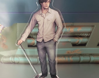 May include: A clear acrylic stand-up figure of a man in a white button-down shirt, gray jeans, and black shoes, holding a golf club. The figure has a detailed illustration and is standing on a clear base. The background is a blurred, pixelated design.