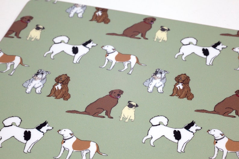 May include: A green background with a repeating pattern of various dog breeds. The dogs are illustrated in a cartoon style and include a pug, a labrador, a schnauzer, a husky, and a spaniel.