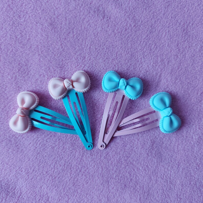 lolita fairy kei pastel goth dolly party kei punk pink blue candy sweets lollipop Kawaii cute pastel pink or blue bow resin hairclips