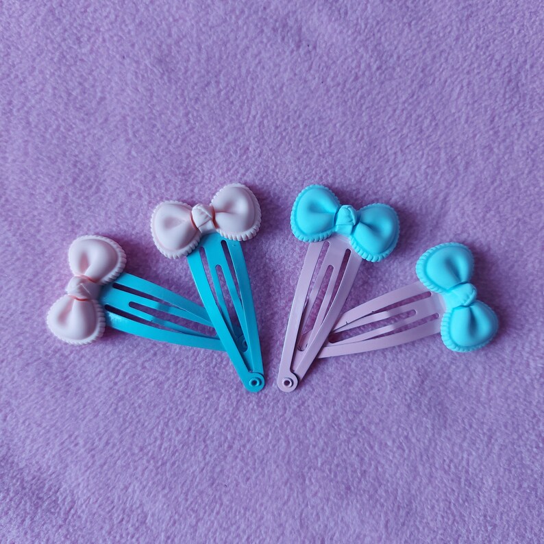 lolita fairy kei pastel goth dolly party kei punk pink blue candy sweets lollipop Kawaii cute pastel pink or blue bow resin hairclips