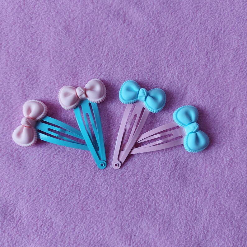 lolita fairy kei pastel goth dolly party kei punk pink blue candy sweets lollipop Kawaii cute pastel pink or blue bow resin hairclips