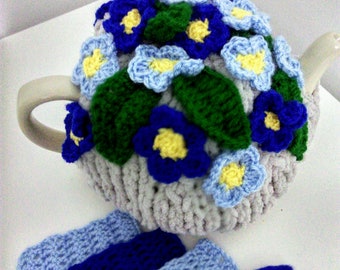 Knitted tea cosy , forget me not flowers