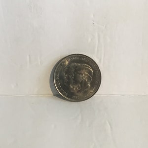 1981 Commemorative Crown Coin, H.R.H. Prince Charles And Lady Diana Spencer. Uncirculated In Plastic Sleeve.