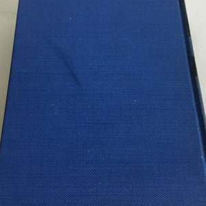 May include: A blue hardcover book with a textured cover.