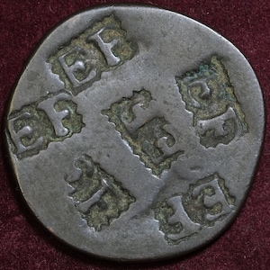 Heavily counterstamped half penny coin EF