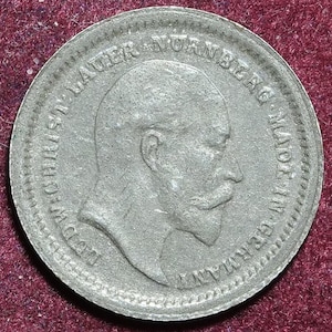 1902 toy money imitation of one shilling coin by Lauer of Nurnberg Germany