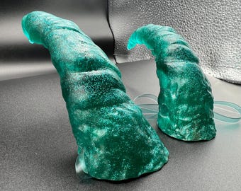 Large, sparkly hand sculpted resin horns headband.