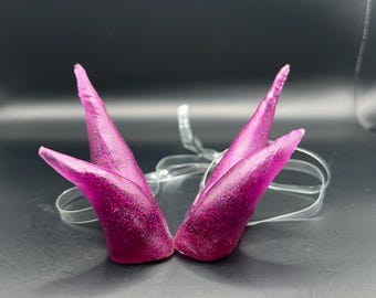 Sparkly small double pointed resin horns