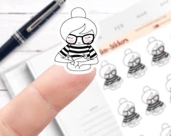 May include: A sticker sheet with a black and white illustration of a woman wearing glasses and a striped shirt. The woman is holding a small object in her hands. The sticker sheet also includes several smaller versions of the same illustration.