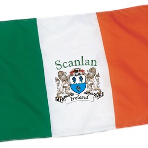 May include: A rectangular flag with vertical stripes of green, white, and orange. The white stripe features the name "Scanlan" in green script above a coat of arms with two lions and the word "Ireland".