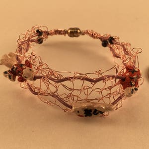 Pink wire bracelet with fish image 2