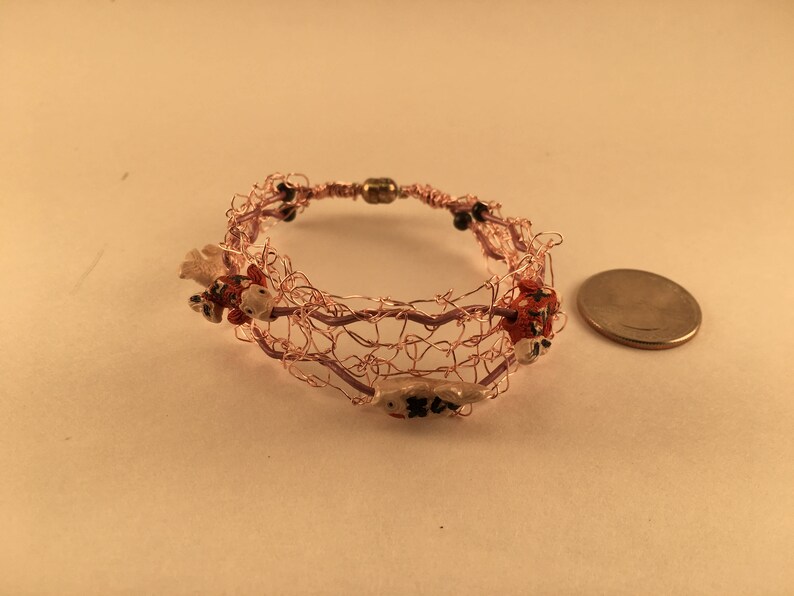 Pink wire bracelet with fish image 2