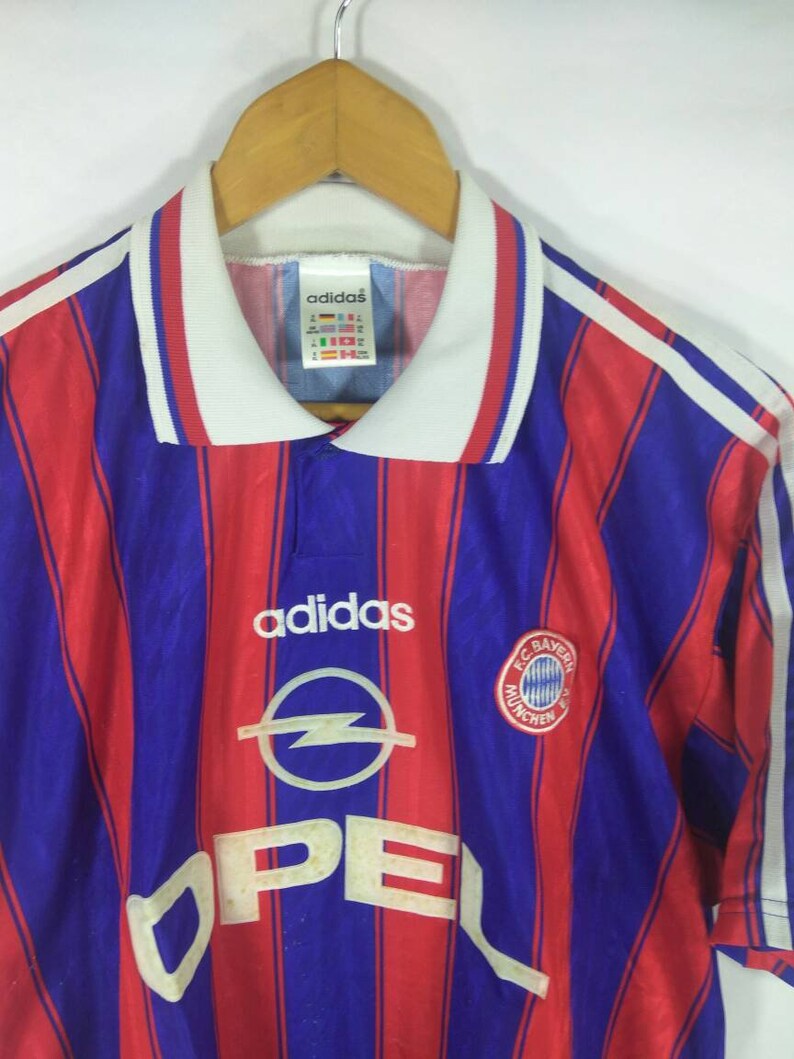 red and blue adidas shirt