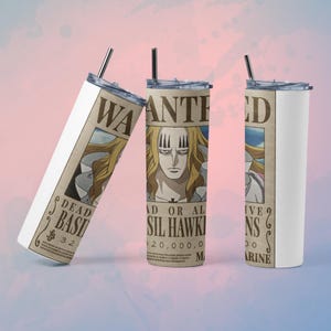 May include: Three stainless steel tumblers with lids and straws. Each tumbler features a "Wanted" poster design with a character illustration and text. The posters are tan with black text and a portrait of a blonde-haired character.