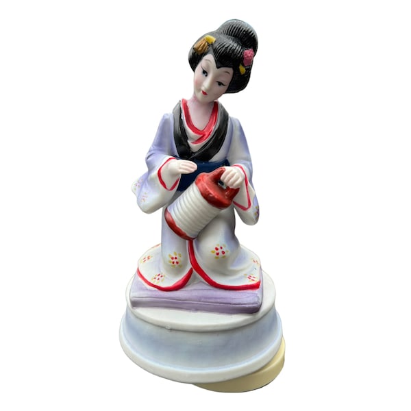 Vintage 1980’s UOGC Porcelain Bisque Geisha Girl Music Box that Spins and Plays, Sukiyaki, which is Printed on the Bottom