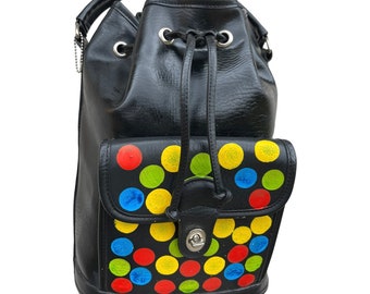 Large Vintage 1990’s Reimagined Black Vegan Leather Backpack with Adjustable Straps and Colorful Dots on Front Pocket