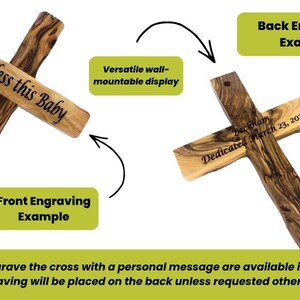 May include: Wooden cross with the text "God Bless this Baby" engraved on the front. The back of the cross shows an example of engraving with the text "Beckham Dedicated March 23, 2024". The cross is a versatile wall-mountable display.