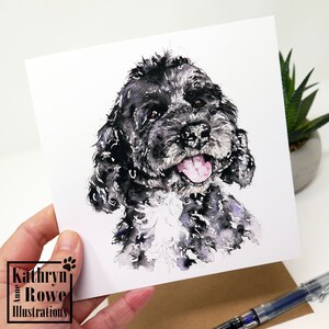 May include: Watercolour painting of a black and white dog with a happy expression. The dog has curly fur and is looking to the right. The painting is on a white card.
