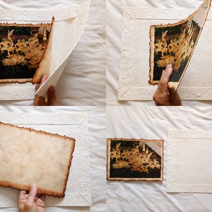 May include: A vintage-style photo of a scene from a play or movie is being framed with a white mat and a decorative border. The photo has a distressed, aged look with brown edges and a faded appearance. The mat is white with a raised, textured design.
