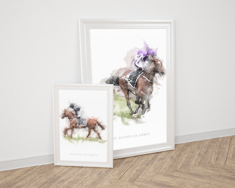 May include: Two framed watercolor paintings of horses and riders. The top painting features a brown horse with a rider wearing a purple helmet and the text "St Nicholas Abbey". The bottom painting features a brown horse with a rider wearing a black helmet and the text "Ruler of the World".