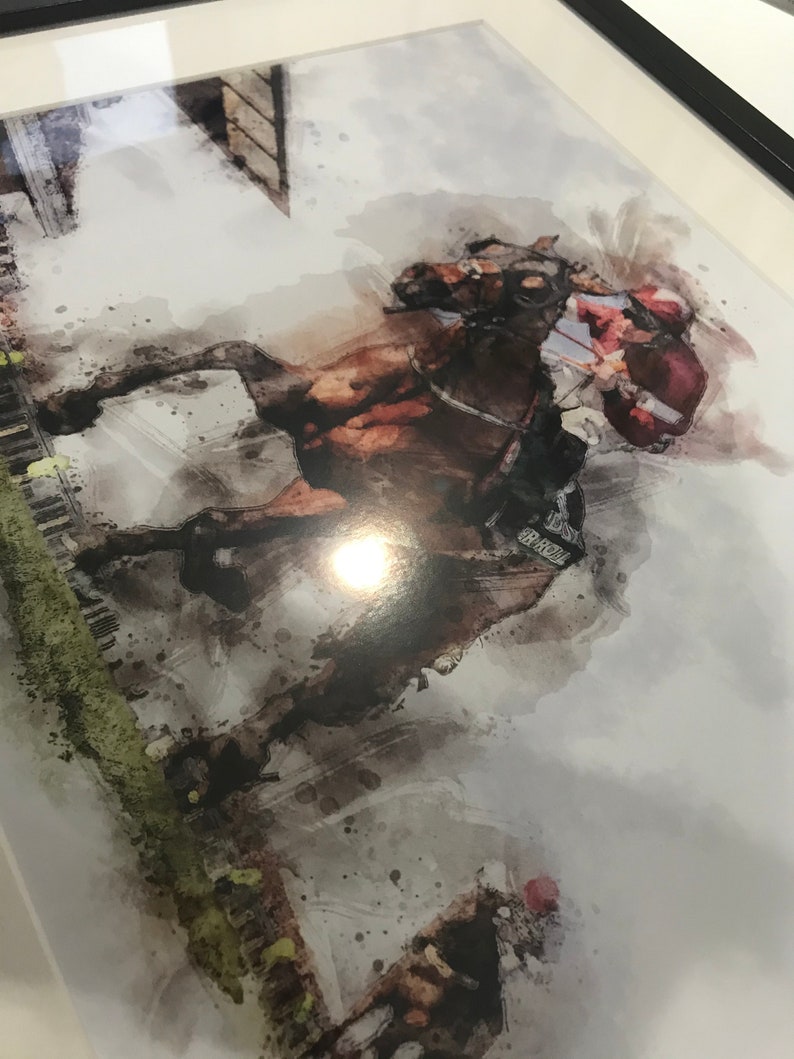 May include: A watercolor painting of a horse and rider jumping over a fence. The horse is brown and the rider is wearing a red and white uniform. The background is a blurry watercolor wash of green and white.