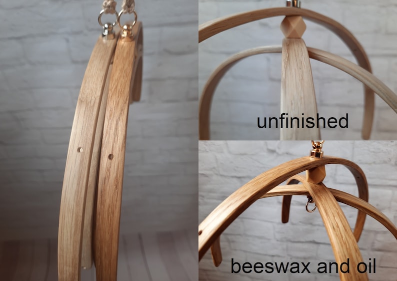 May include: Two wooden baby mobile frames, one unfinished and one finished with beeswax and oil. Both frames have a gold metal hook and a wooden knob at the top.