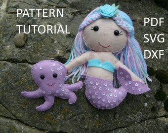 May include: A felt mermaid doll with blue and purple hair, a turquoise top, and a sequined purple tail, next to a purple felt octopus. The image includes the text "PATTERN TUTORIAL" and "PDF SVG DXF".