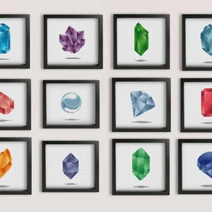 May include: A set of 12 framed prints featuring different coloured gemstones. The prints are arranged in a grid of four rows and three columns. Each print features a single gemstone on a white background.