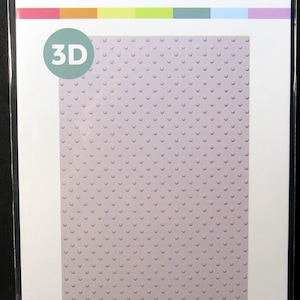 May include: A Scrapbook.com 3D embossing folder with a polka dot pattern. The packaging features the text 3D EMBOSSING FOLDER, POLKA DOTS, and 1 Folder 5.5 x 8.5in POLKA DOTS. The folder itself is a light purple color with a raised dot texture.