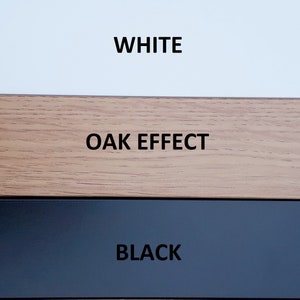 May include: Three color swatches showing different finishes: white, oak effect, and black.