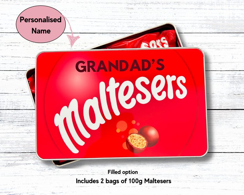 May include: Red and white tin with the text "GRANDAD'S Maltesers" on the front. The tin is filled with two bags of 100g Maltesers.