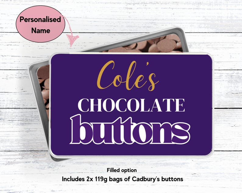 May include: A purple metal tin with a white label that says "Cole's Chocolate buttons". The label has gold lettering. The tin is filled with chocolate buttons.