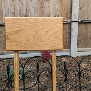 A solid Oak blank plaque with two posts attached