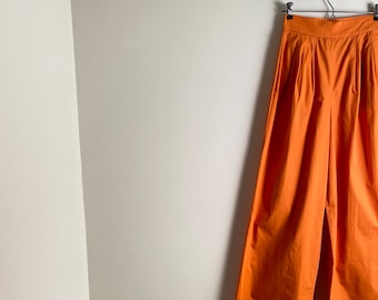 CHRISTIAN DIOR vintage orange trousers with high waist, pleated front and wide legs / xs / s / 1980s