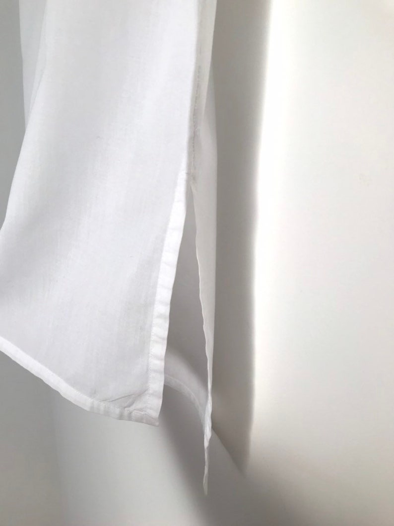 Vintage white embroidered short sleeve button down pin tuck tunic blouse with floral patterns and mock neck collar s m 1970s