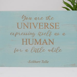 You are the universe expressing itself as a human for a little while -Eckhart Tolle 5x7, 8x12, 10x15, 15x22, 20x30, 24x36 Engraved Wood Sign