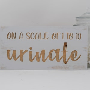 On a scale of 1 to 10 urinate 5x10, 8x15, 10x20, 15x28, 18x35 Engraved Wood Sign